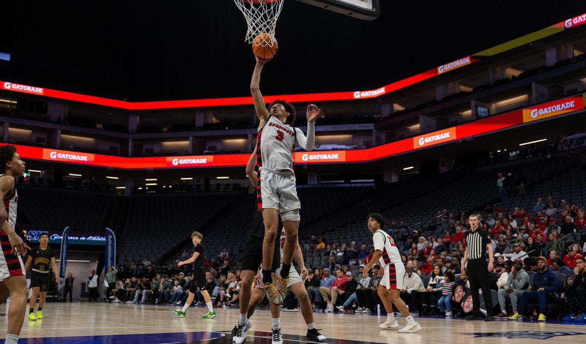 Woodland Christian Cardinals guard Romello Bruhn (3) scores a basket against Argonaut during the CIF Sac-Joaquin Section Division V boys basketball championship game at Golden 1 Center on Feb. 28.