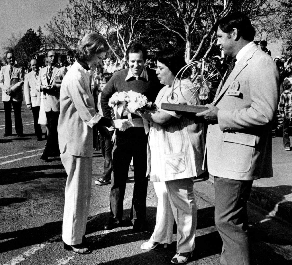 First Lady Rosalynn Carter is greeted by Davis city leaders in March 1979.