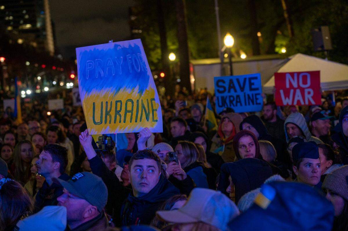 A sign reads “pray for Ukraine” at the state Capitol on Friday.