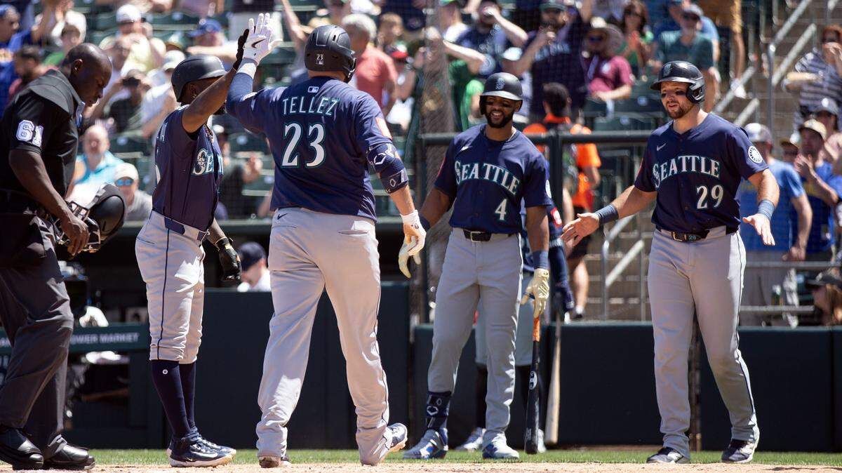 May 7, 2025; West Sacramento, California, USA; Seattle Mariners first baseman Rowdy Tellez (23) is greeted by his teammates after hitting a three-run home run against the Athletics during the sixth inning at Sutter Health Park. Mandatory Credit: D. Ross Cameron-Imagn Images