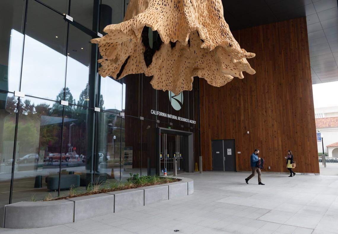 State workers walk outside of the new California Natural Resources Building at 715 P Street in Sacramento in November.