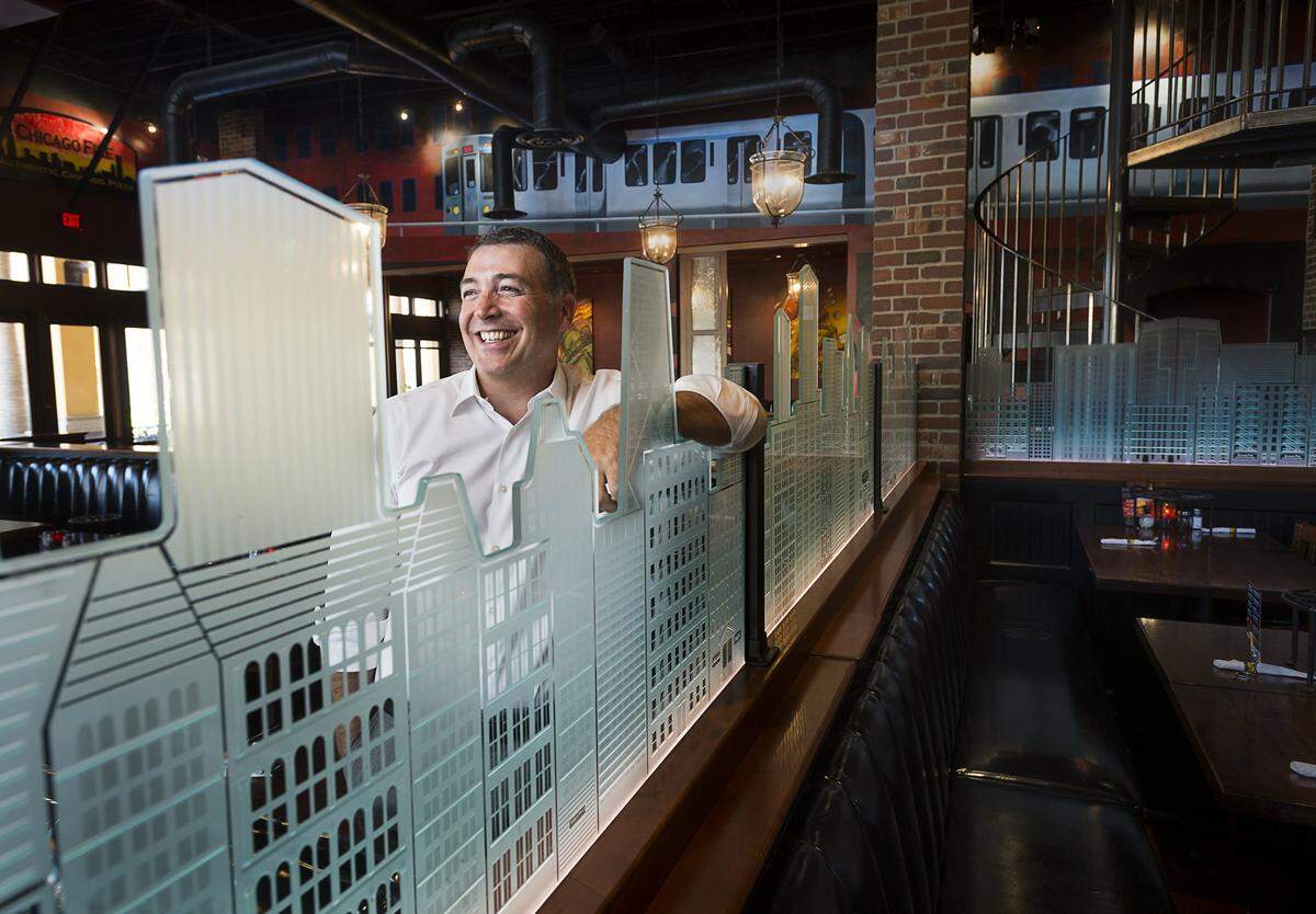 Eric Schnetz, who founded the Chicago Fire pizza chain, poses in the main dining room at his Chicago Fire restaurant in Folsom in 2015. 