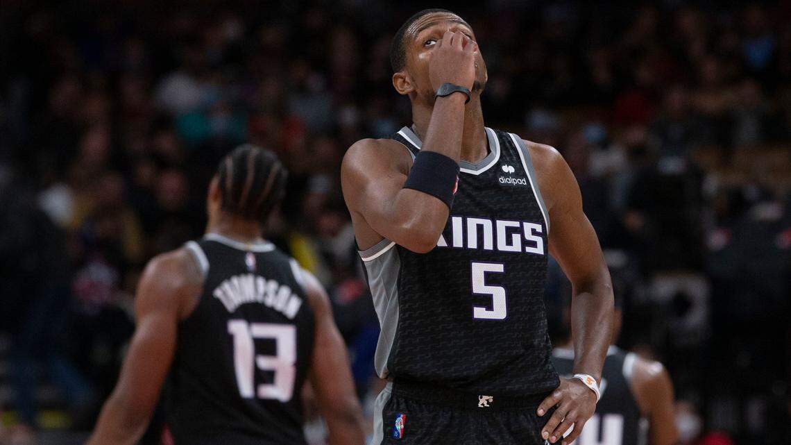 Sacramento Kings’ De’Aaron Fox reacts during his team’s loss to the Toronto Raptors in NBA basketball game action in Toronto, Monday, Dec. 13, 2021. (Chris Young/The Canadian Press via AP)