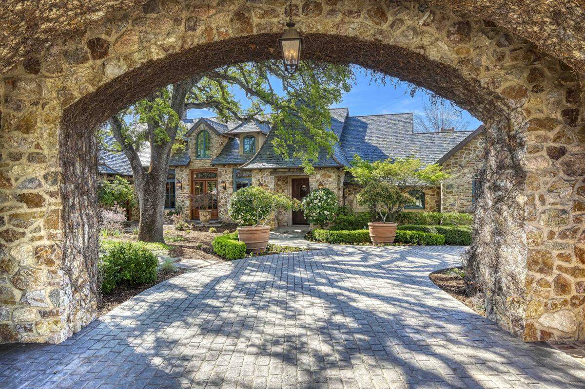 The entrance to the French country-style estate is magical.