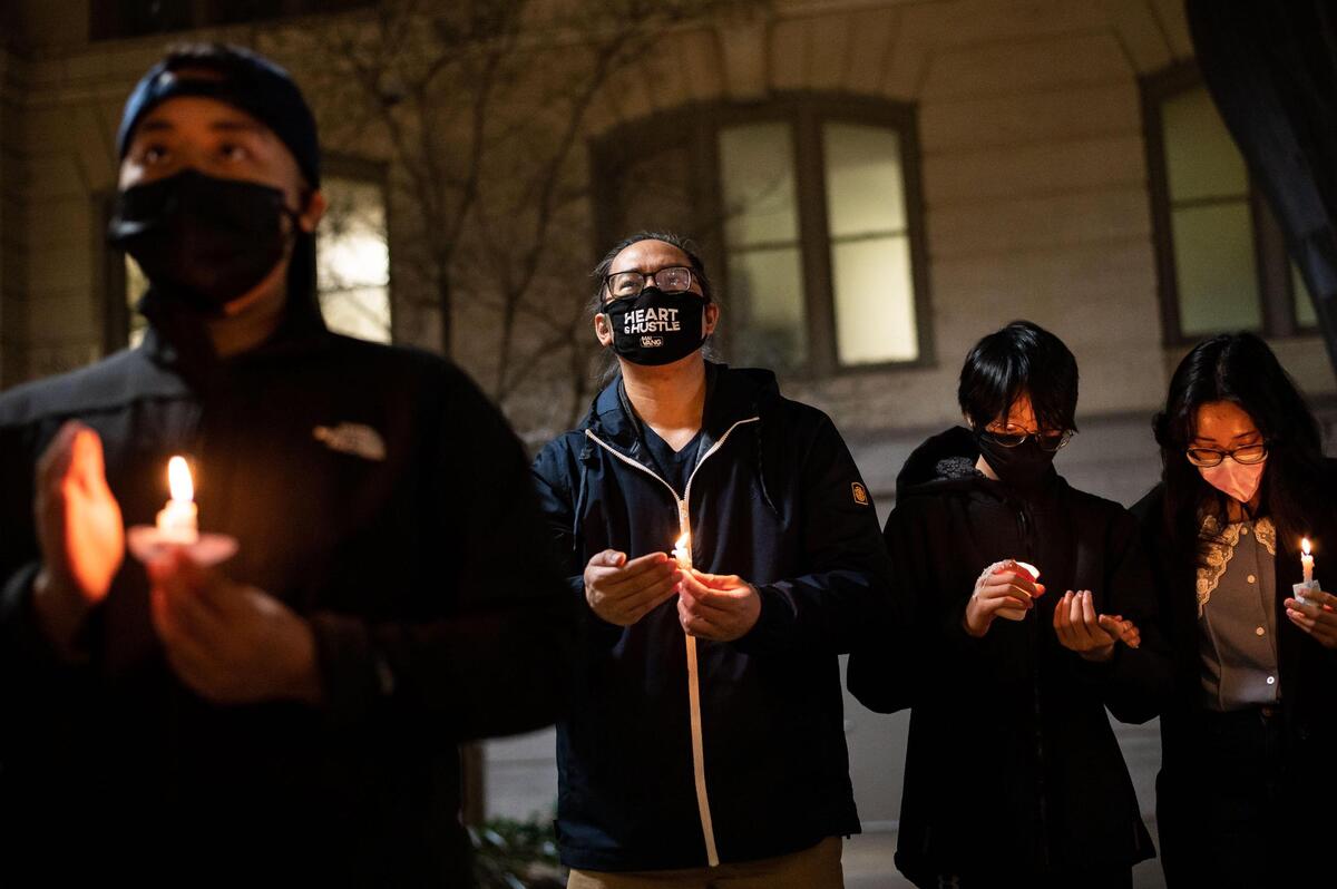 Asian American and Pacific Islander and other community members gather for a candlelight vigil in front of Sacramento City Hall on Wednesday, March 17, 2021, to honor the victims from Tuesday’s mass shooting in Atlanta.