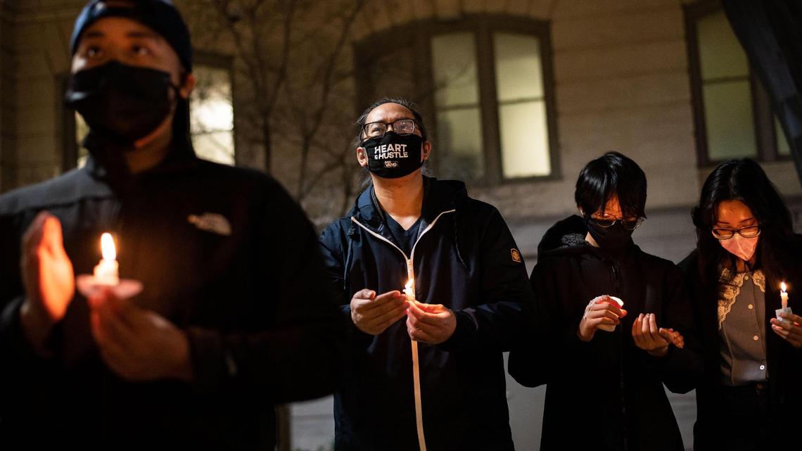 Asian American and Pacific Islander and other community members gather for a candlelight vigil in front of Sacramento City Hall on Wednesday, March 17, 2021, to honor the victims from Tuesday’s mass shooting in Atlanta.