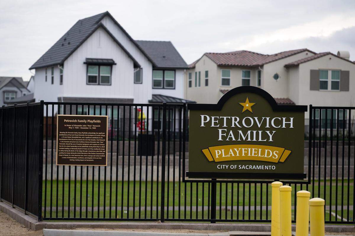 The “Petrovich Family Playfields” is name of the new park in the Crocker Village development in Sacramento, according to signs on display on Wednesday, Dec. 6, 2023.