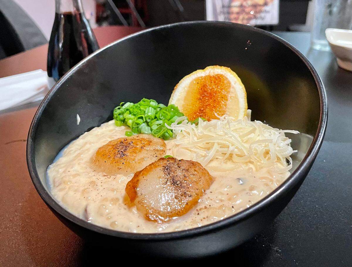 Koi Japanese Bistro’s miso-and-mushroom risotto with pan-seared scallops is both creamy and savory.
