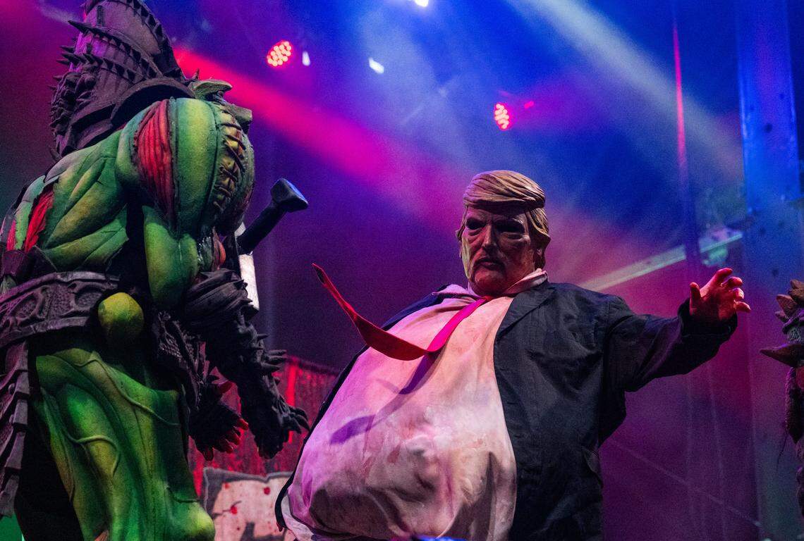A character portraying President Donald Trump dances with Gwar’s Bonesnapper before being eviserated during the heavy metal band’s set at the Aftershock festival on Sunday, Oct. 5, 2025, in Sacramento’s Discovery Park.