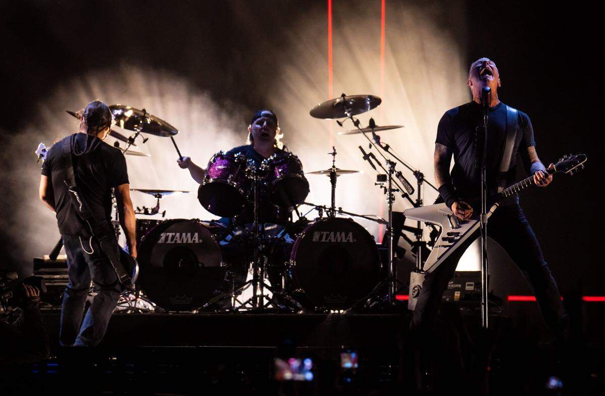 Metallica lead vocalist James Hetfield, right, performs to close out the second day of the Aftershock Festival on Friday, Oct. 8, 2021, at Discovery Park in Sacramento. Bassist Robert Trujillo, left, drummer Lars Ulrich and lead guitarist Kirk Hammett played alongside Hetfield to thousands of fans. The four-day festival, returning after a hiatus in 2020 due to the COVID-19 pandemic, ends Sunday with another performance by Metallica.