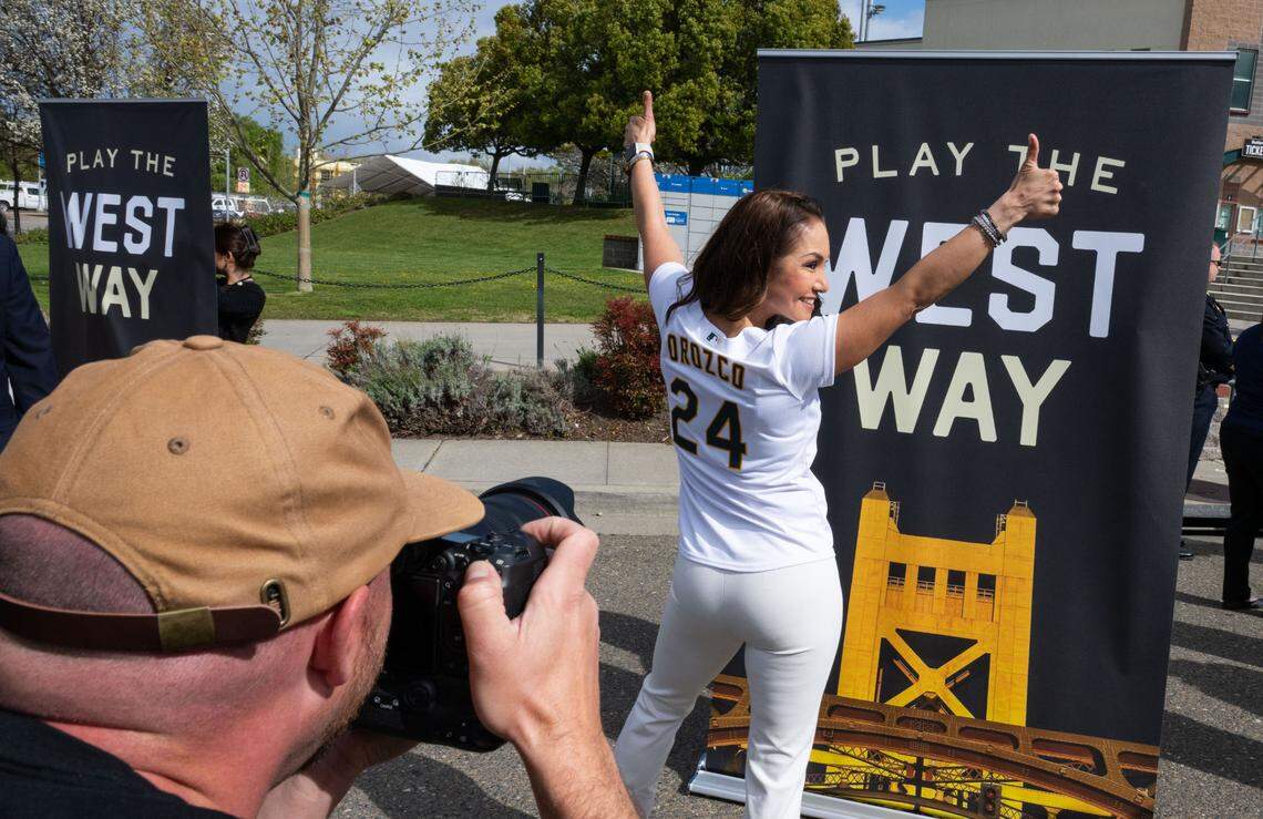 West Sacramento City Councilmember Quirina Orozco shows off her customized Athletics jersey at Sutter Health Park after a press conference Thursday to officially welcome the A’s to West Sacramento and celebrate the coming opening days for the city’s baseball teams.
