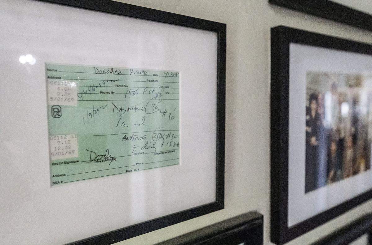A prescription for medicine made out to Dorothea Puente, part of a collection of ephemera related to the crimes of the notorious serial killer, hangs in the hall of her former home.