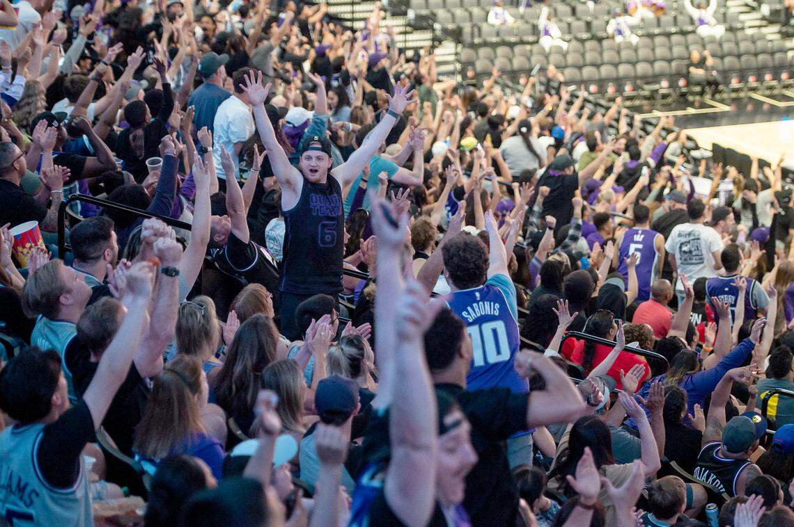 Sacramento Kings fans cheer as guard De’Aaron Fox (5) makes a 3-pointer at the end of the first quarter at the Game 4 watch party at Golden 1 Center on Sunday.