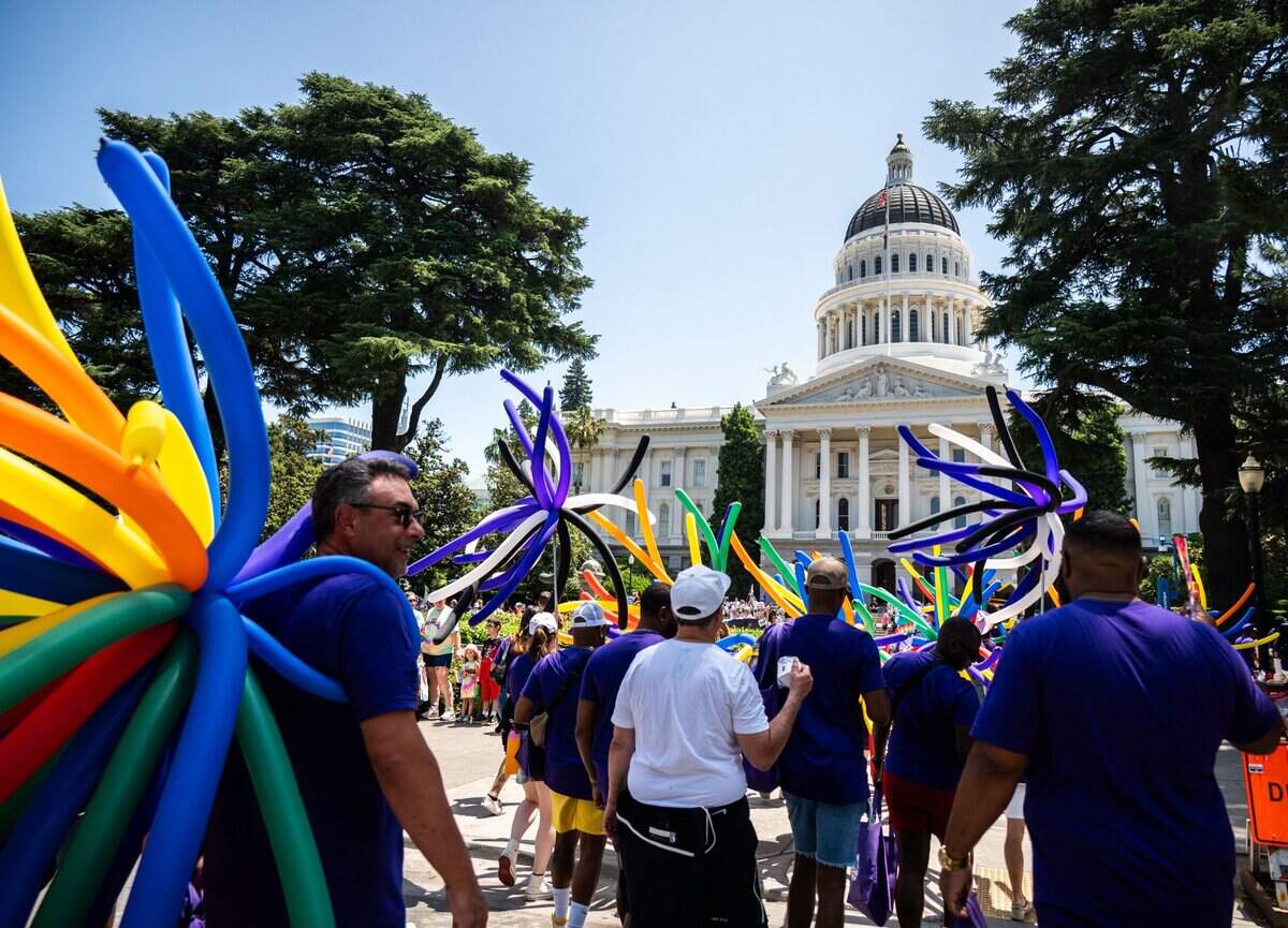 Participants representing the Sacramento Kings make their way to the state Capitol in the Sacramento Pride March on Sunday.