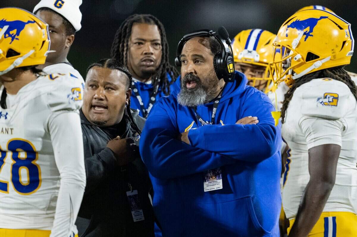 Grant Pacers coach Carl Reed, center, talks with the team during a timeout in the first half of the CIF Division 2-AA state football championship against the La Serna Lancers on Friday, Dec. 8, 2023, at Saddleback College in Mission Viejo.