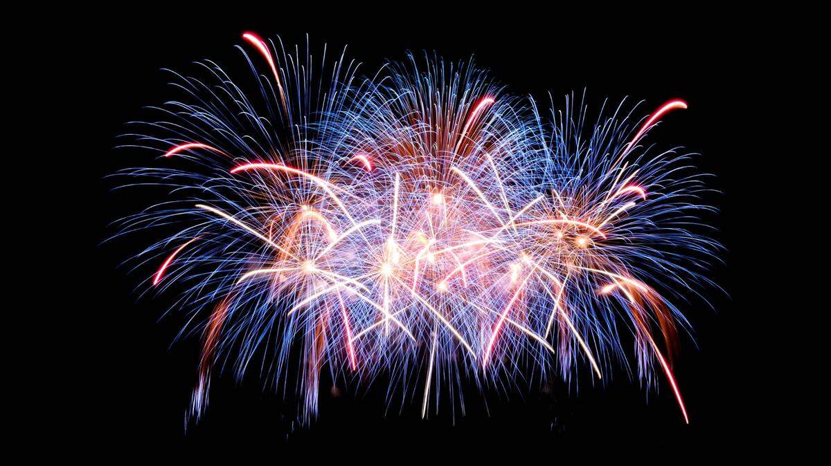 Two lost hikers spent New Year’s Eve stranded on a trail in Hawaii after fireworks prevented a helicopter rescue, officials say.