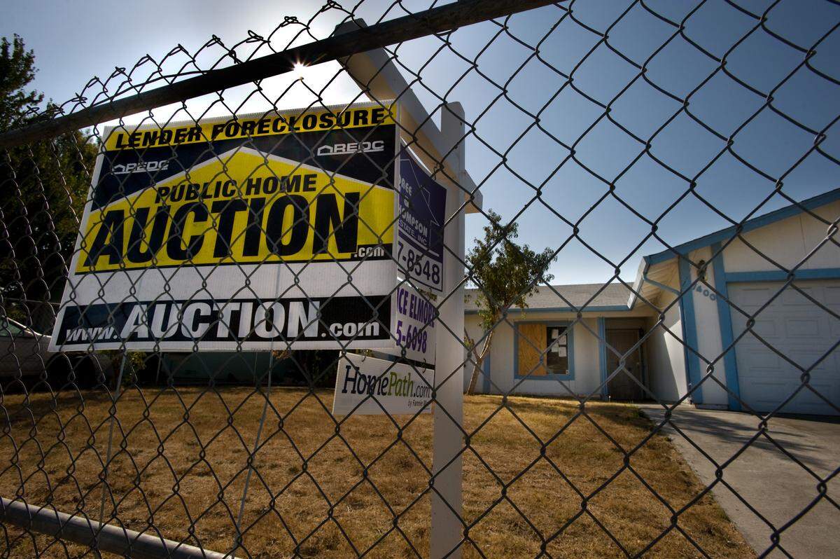 A lender foreclosure sign sits in the front yard of a vacant Sacramento home in 2010. At one point during the Great Recession, foreclosures made up around 80% of home sales. Distressed sales are currently a very small percentage of the market, but some experts believe foreclosures could increase in coming months.