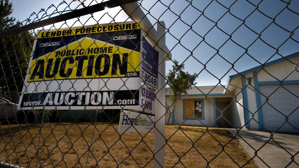 A lender foreclosure sign sits in the front yard of a vacant Sacramento home on Oct. 10, 2010. A bill aims to limit a tax break for owners of more than 50 single-family rental properties. 