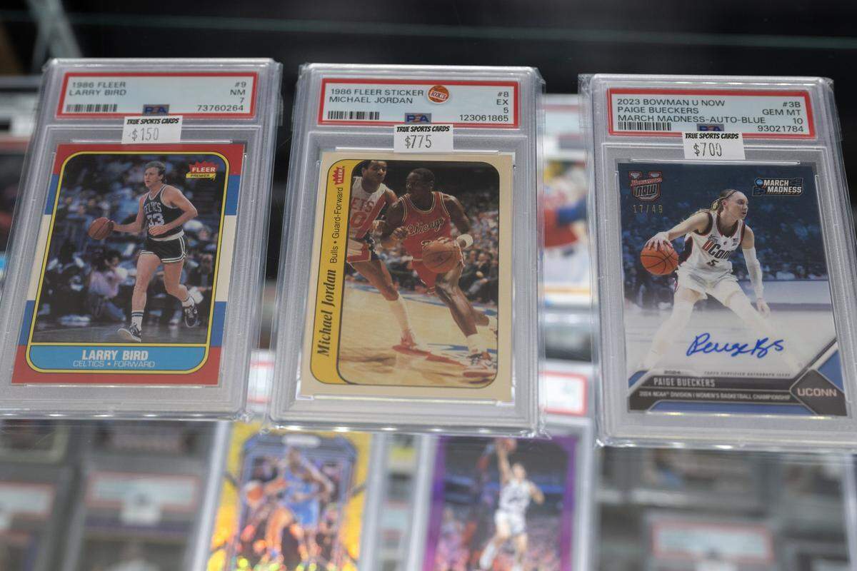 Display cases hold sports trading cards at True Sports Cards in Rocklin on Monday, Oct. 6, 2025. Sports trading card collecting is becoming more popular among kids, who are thinking about the investment value of their collection.