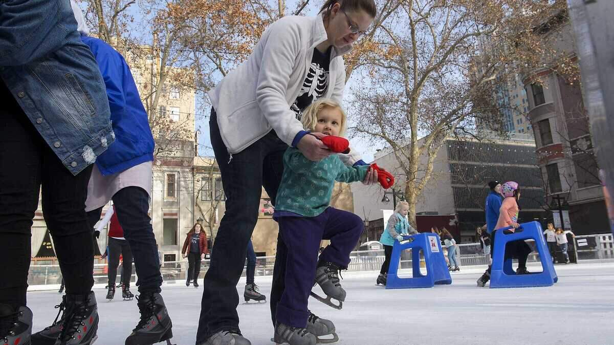 Sara Lynch of Santa Cruz helps her 3-year-old daughter, Katherine, learn to ice skate at the Downtown Sacramento Ice Rink in 2017. The city of Roseville will open its first outdoor ice rink on Vernon Street on Dec. 7, adding a new seasonal attraction for families in the capital region.