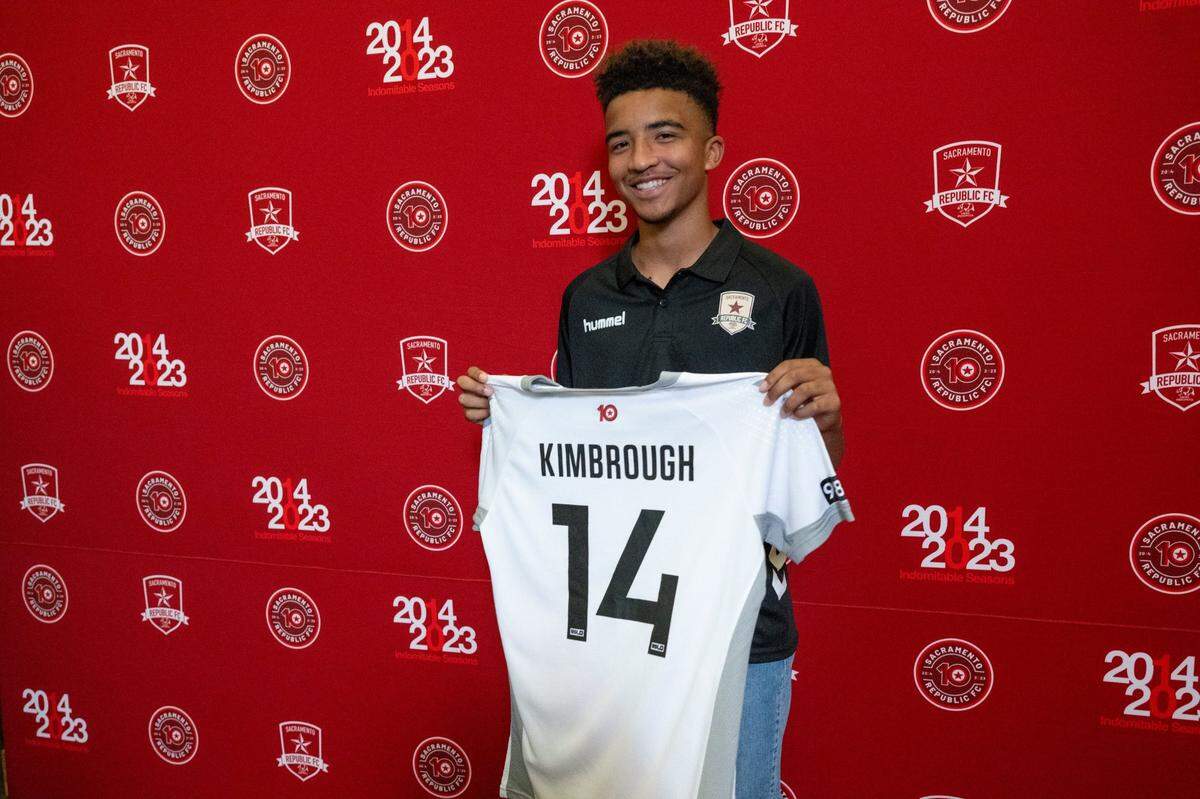 13-year old soccer phenom, Davian Kimbrough, holds his Sacramento Republic jersey after they signed him Tuesday, making him the youngest professional athlete in American sports history.