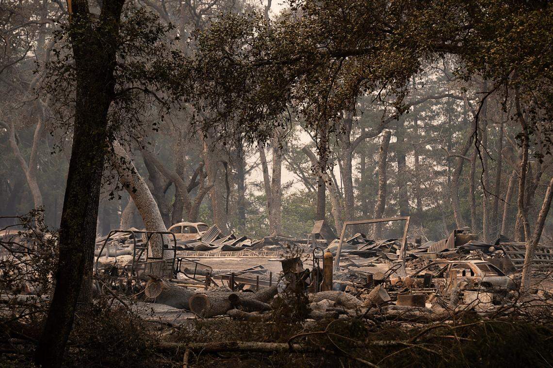 The remains of homes and vehicles on Deer Park Road destroyed during the Glass Fire are visible on Sept. 28 in Napa County.