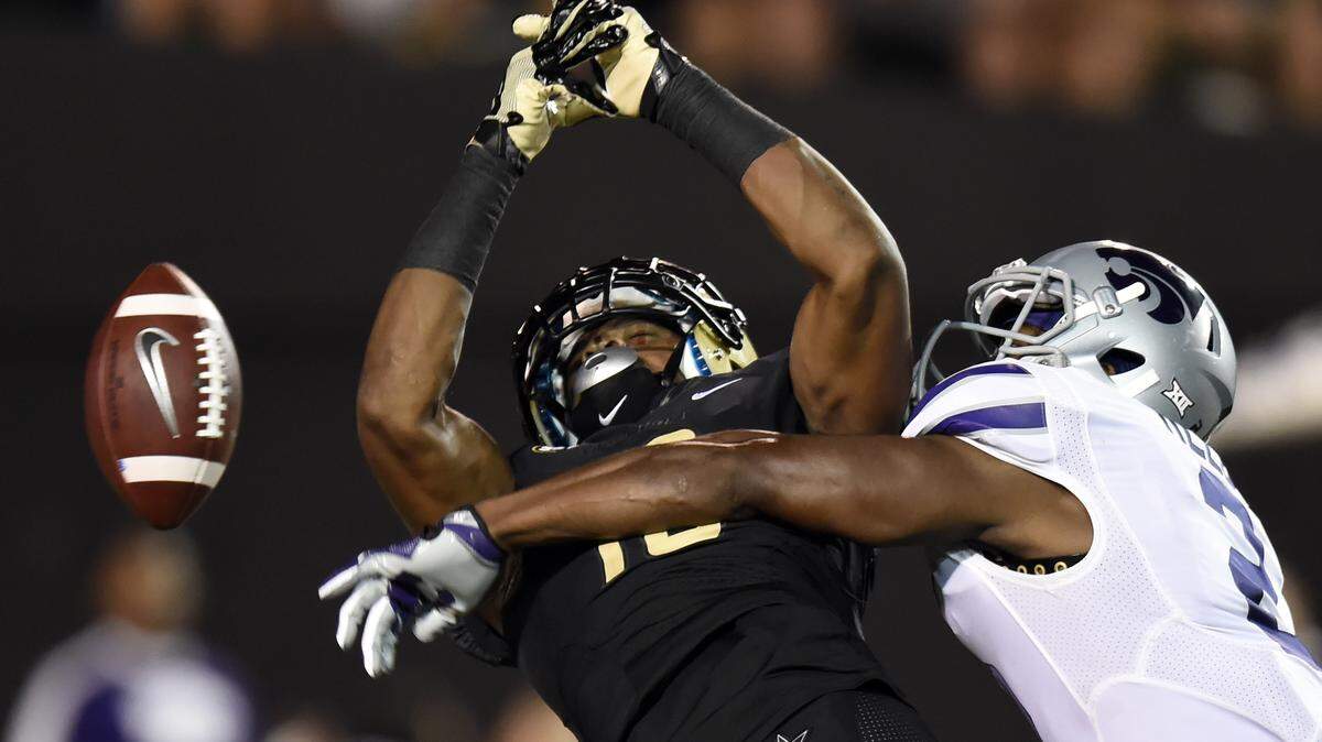 Kansas State defensive back D.J. Reed (2) breaks up a pass intend for Vanderbilt wide receiver Kalija Lipscomb (16) in the second half of an NCAA college football game Saturday, Sept. 16, 2017, in Nashville, Tenn. Vanderbilt Won 14-7.