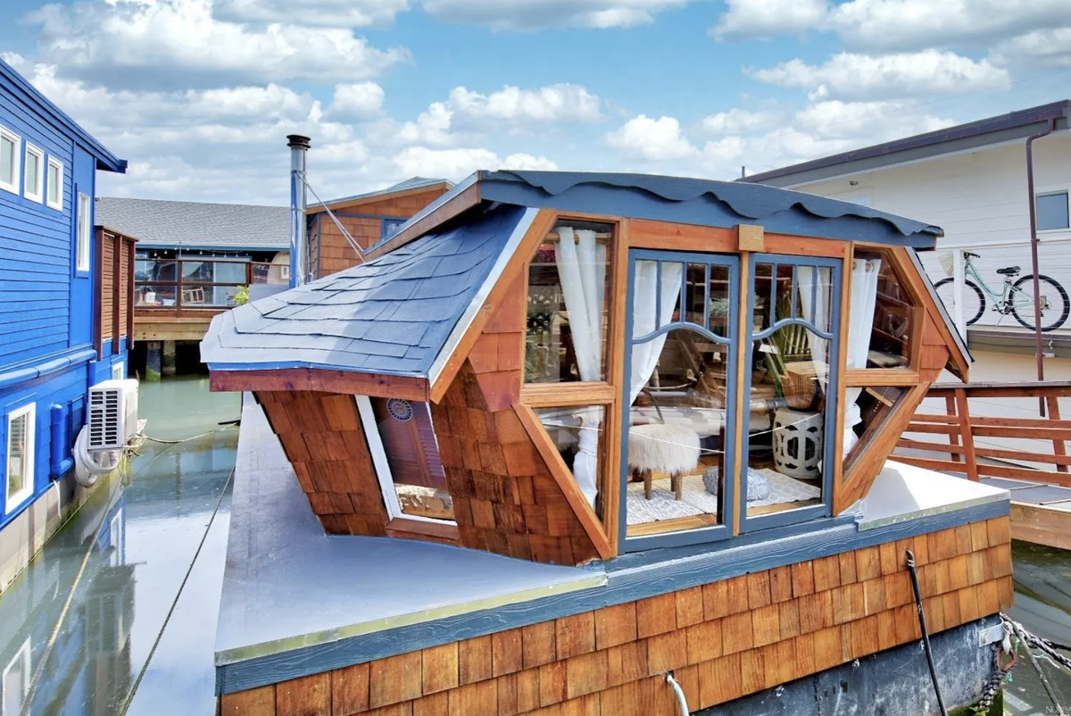 The floating house was a former WWII landing craft.