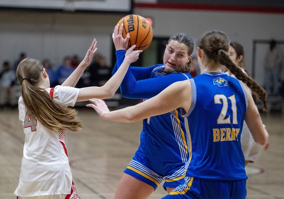 The Faith Christian Lions’ Lauren Harris is defended by Sacramento Adventist Capitals Isabella Pacheco (4) in the second half on Tuesday in Carmichael.