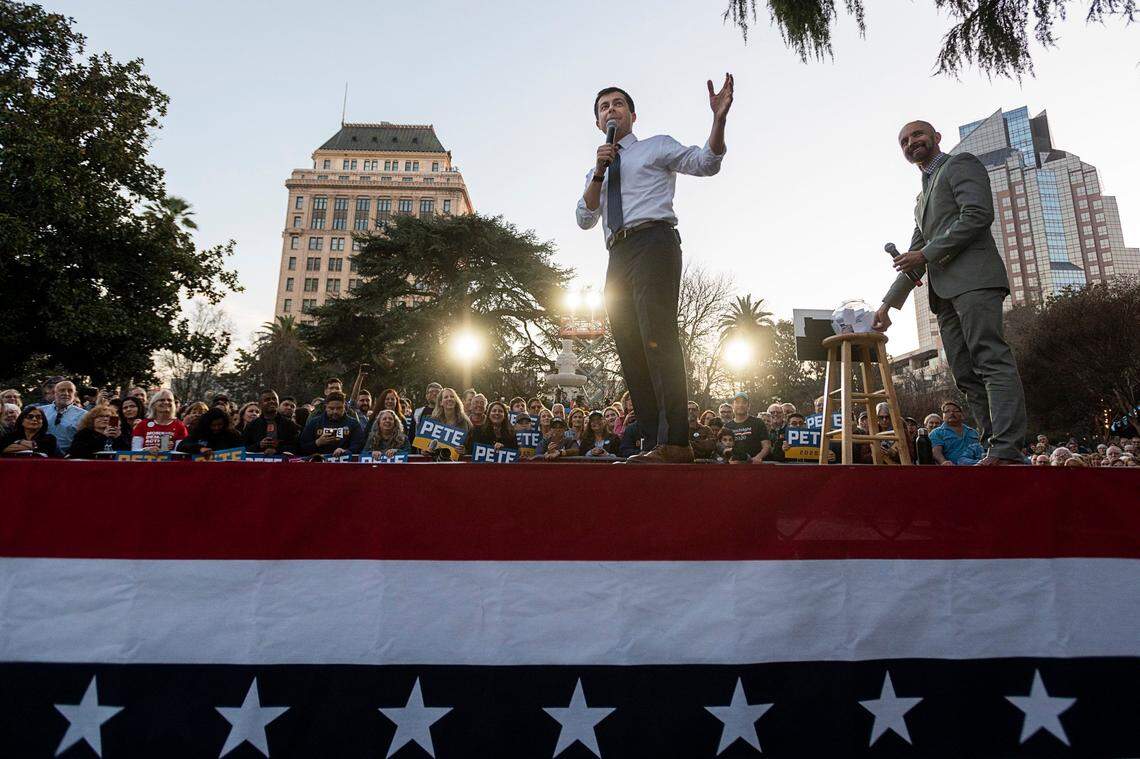 Democratic presidential candidate Pete Buttigieg, center, speaks to supporters during a Q&A with West Sacramento Mayor Christopher Cabaldon, right, during a rally at Cesar Chavez Plaza on Friday, Feb. 14, 2020 in Sacramento.