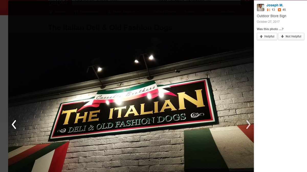 A screenshot from Yelp shows a user post of an outdoor sign from the now closed Italian Deli & Old Fashioned Hot Dogs restaurant. 