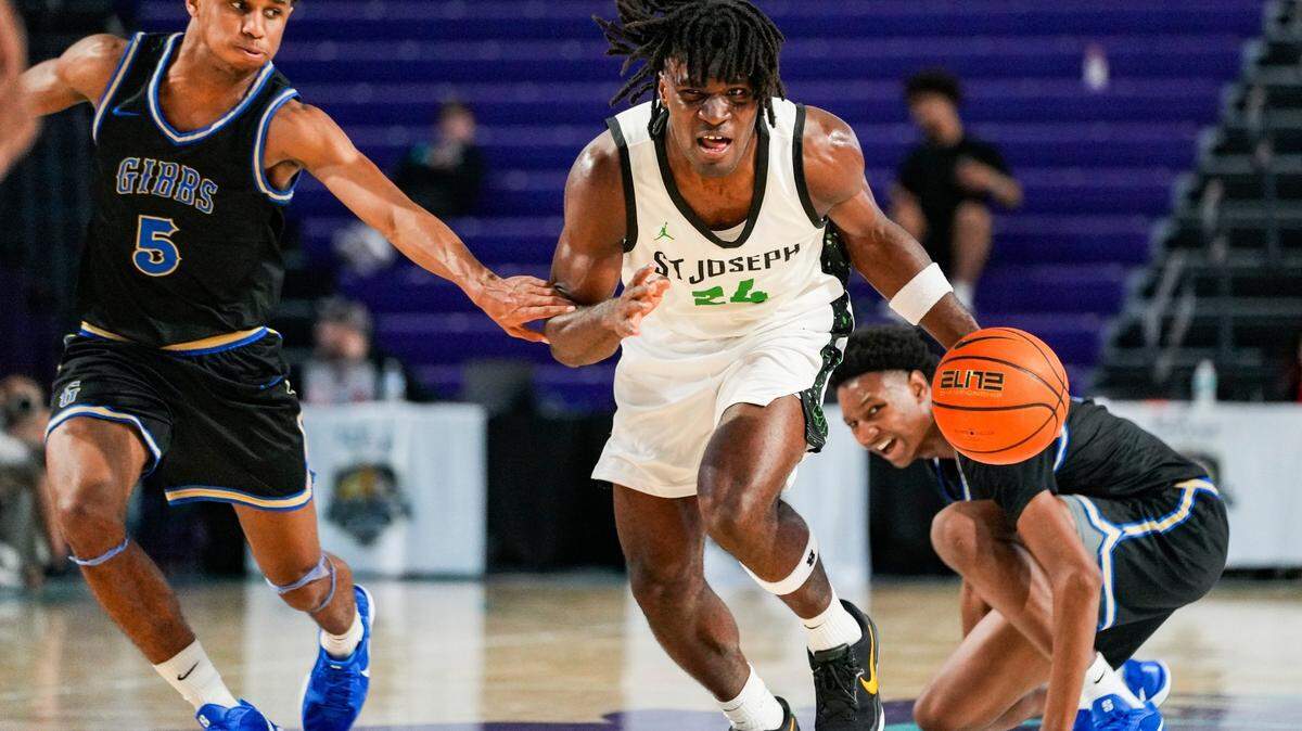 St. Joseph Knights forward Tounde Yessoufou (24) brings the ball up court as Gibbs Gladiators guard Oneal Delancy (5) runs with him during the third quarter of the City of Palms Classic sunshine series championship game at Suncoast Credit Union Arena in Fort Myers, Fla., on Saturday, Dec. 21, 2024.