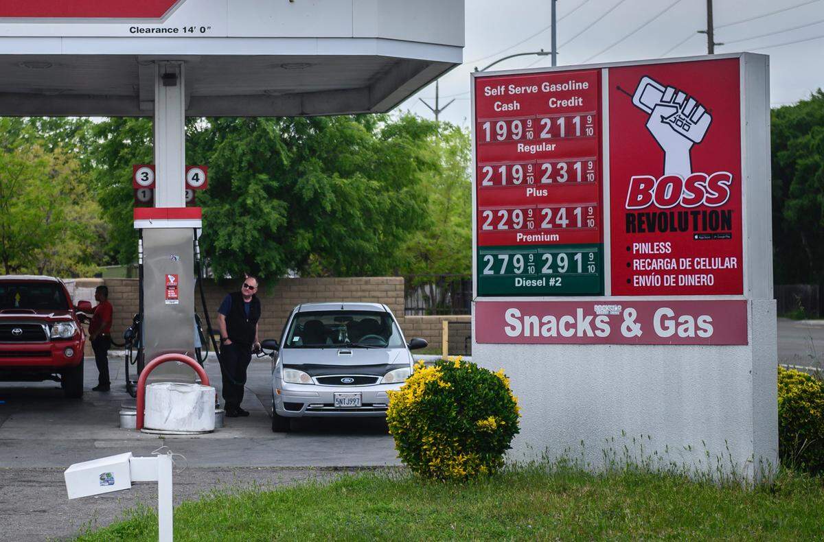 A man fills up his tank at Snacks & Gas on El Camino Avenue in Sacramento on Monday, April 20, 2020. The station was selling a gallon of regular gas for $1.99, the lowest price in the region according to fuel trend analysis website GasBuddy.com. The average price of a gallon in the region has dropped to $2.63, a number not seen since January 2017.
