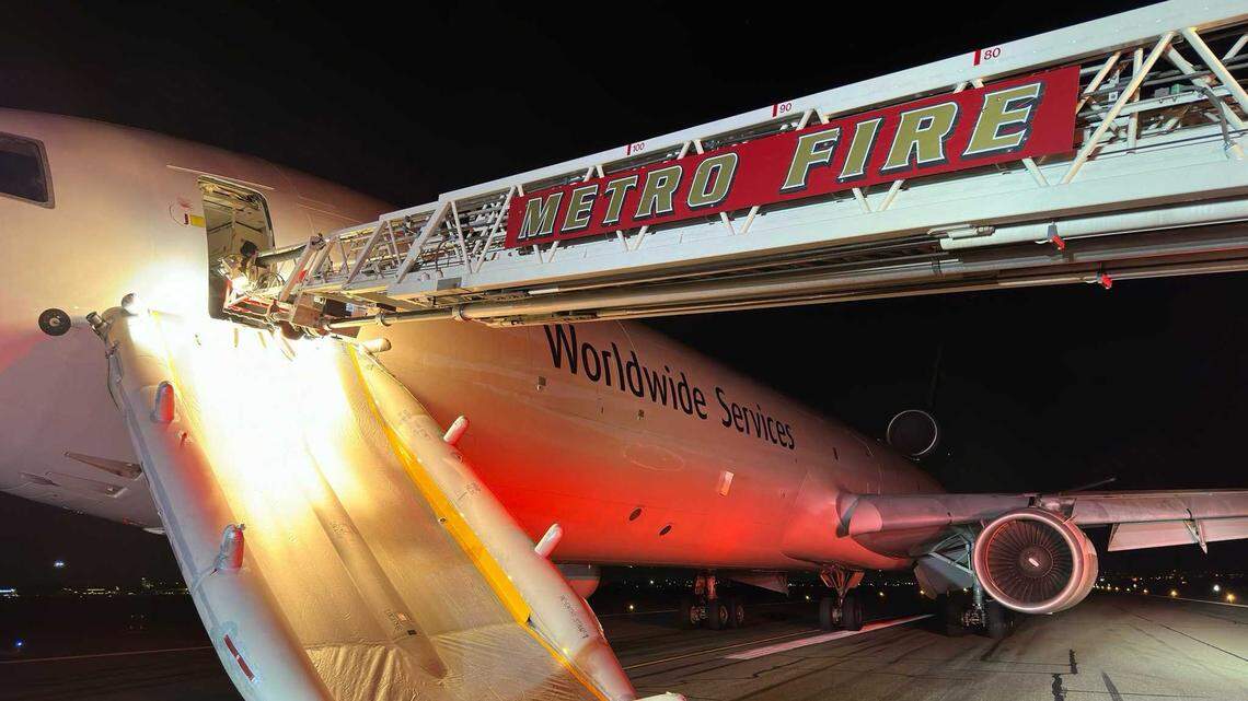 Firefighters are seen on the tarmac of Mather Airport on Wednesday, Sept. 4, 2024, following the emergency landing of a UPS freighter jet. No injuries were reported after the pilots reported smoke in the cockpit before their diversion.