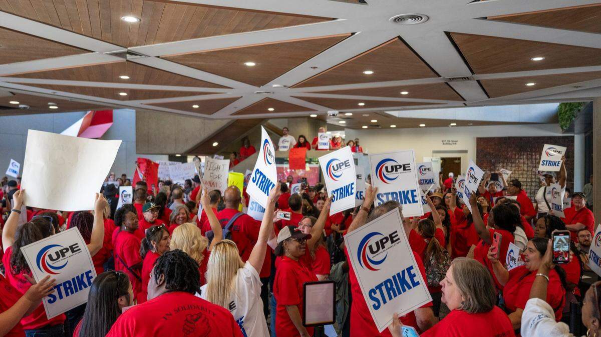 Sacramento County employees and members of the United Public Employees union participate in a one-day strike for a pay increase at the Sacramento County Administrative Building in downtown Sacramento on Tuesday, July 8, 2025.