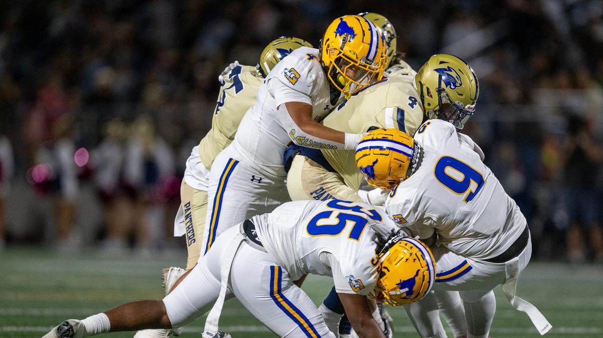 West Park Panthers running back Ben Osby (4) is swarmed by the Grant Pacers’ Malachi Simonton (9), Giovanni Hodge (35) and Ernie Tofi (4) in October. Grant hosts Jesuit this Friday in a CIF Sac-Joaquin Section Division II playoff matchup, while West Park is the No. 2 seed in Division III.
