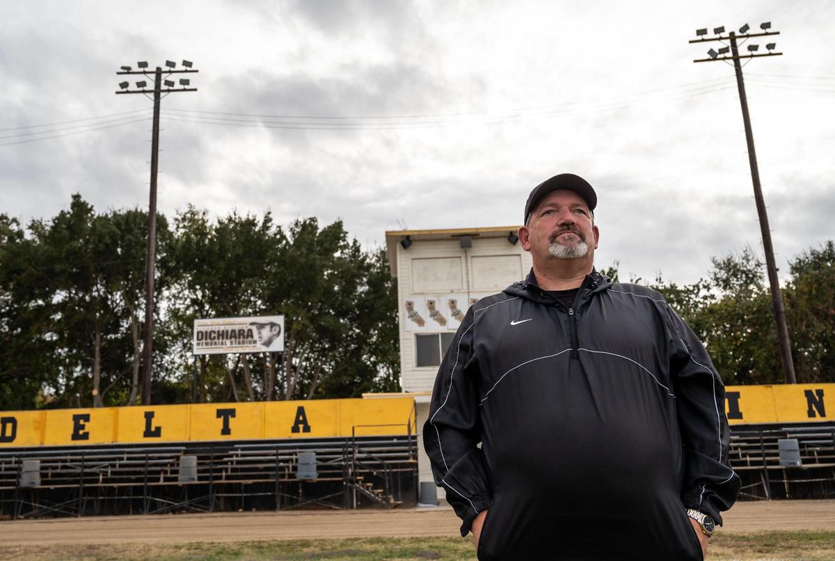 Delta High School football co-head coach Tim Rapp stands in front of the home-side stands after practice Wednesday, Oct. 20, 2021, in Clarksburg.