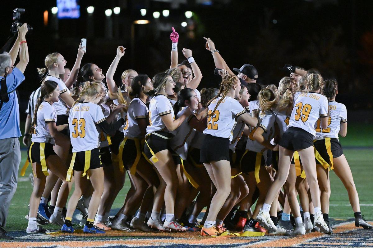 The Del Oro Golden Eagles celebrate after winning the CIF Sac-Joaquin Division I flag football championship against the Woodcreek Timberwolves on Saturday, Nov. 4, 2023, at Cosumnes River College in Sacramento.
