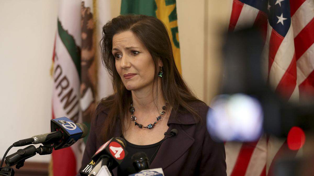 Oakland Mayor Libby Schaaf takes questions from the media during a press conference at City Hall in Oakland, Calif., Wednesday, Feb. 27, 2018. Schaaf reportedly helped extinguish a fire set at the oak tree in front of City Hall on Friday morning.