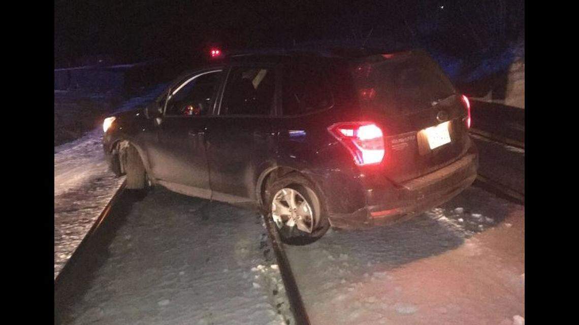 A driver blamed bad GPS directions for a wrong turn onto train tracks in Ayer, Massachusetts, then kept going to try to reach the next crossing, police say. Cops stopped train traffic and rescued her.