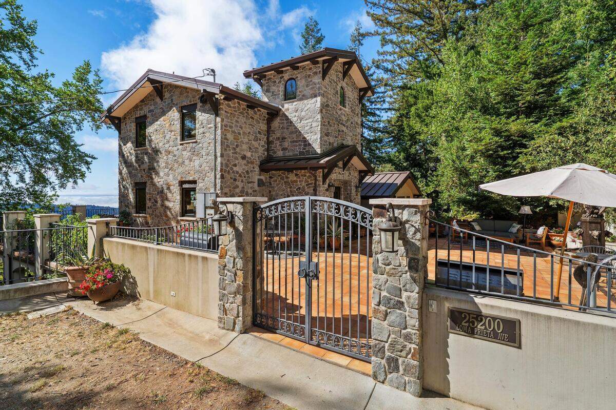 The adobe residence at Lago Lomita, designed by Guy Denues, combines bespoke craftsmanship with sweeping outdoor views, blending luxury living and natural beauty on 44 secluded acres.