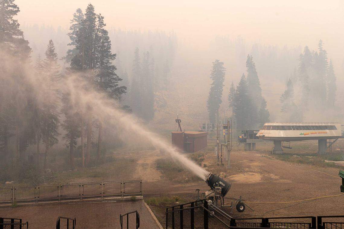 A snow blower sprays water at Sierra-at-Tahoe ski resort on Aug. 30, 2021, after the Caldor Fire burned through the area. The resort avoided major structural damage but lost 80% of its trees and underwent extensive recovery efforts before fully reopening.