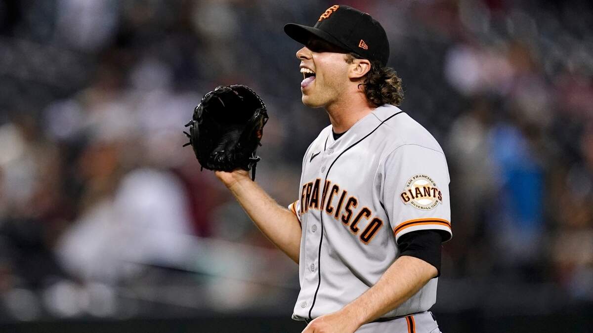 San Francisco relief pitcher Sam Long celebrates the team’s win over the Arizona Diamondbacks on July 6, 2022, in Phoenix.