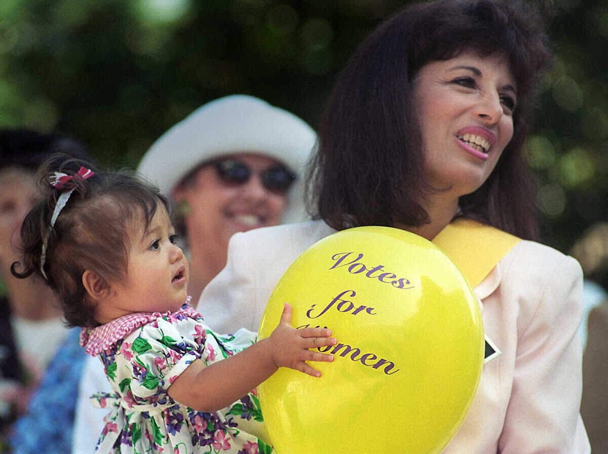 Assemblywoman Jackie Speier, D-Burlingame, holds her 1-year-old daughter, Stephanie Sierra, at a celebration on Aug. 26, 1995, of the 75th anniversary of the passage of the 19th Amendment guaranteeing women the right to vote. Speier was a featured speaker at the event, held on the west steps of the state Capitol.