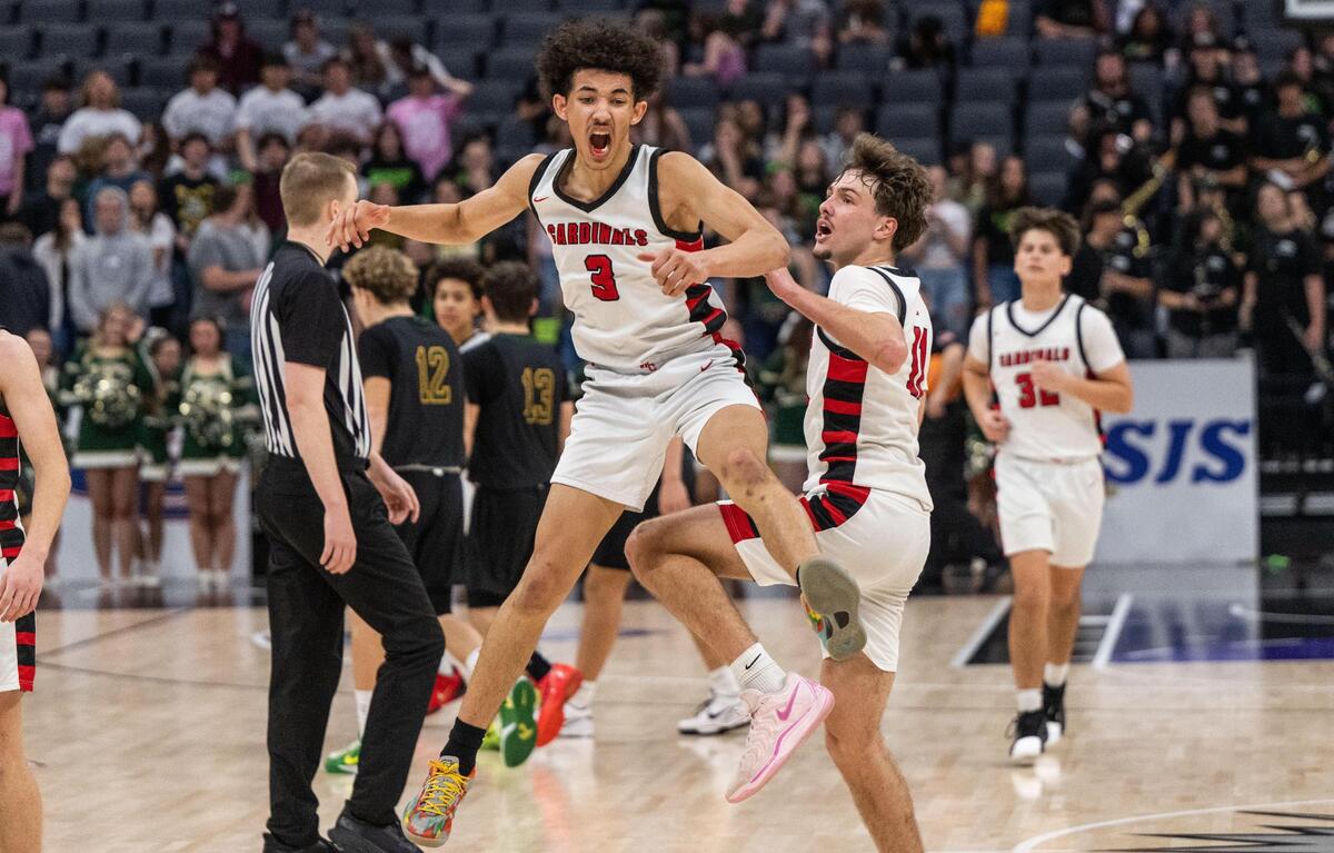The Woodland Christian Cardinals’ Romello Bruhn (3) and Tanner Thomas (11) celebrate their 87-63 victory against Argonaut during a CIF Sac-Joaquin Section Division V boys basketball championship game at Golden 1 Center on Friday, Feb. 28, 2025.