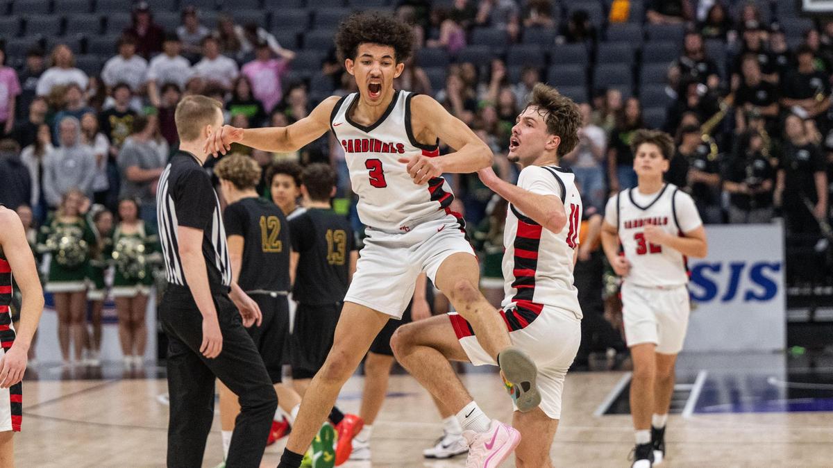 The Woodland Christian Cardinals’ Romello Bruhn (3) and Tanner Thomas (11) celebrate their 87-63 victory against Argonaut during a CIF Sac-Joaquin Section Division V boys basketball championship game at Golden 1 Center on Friday.