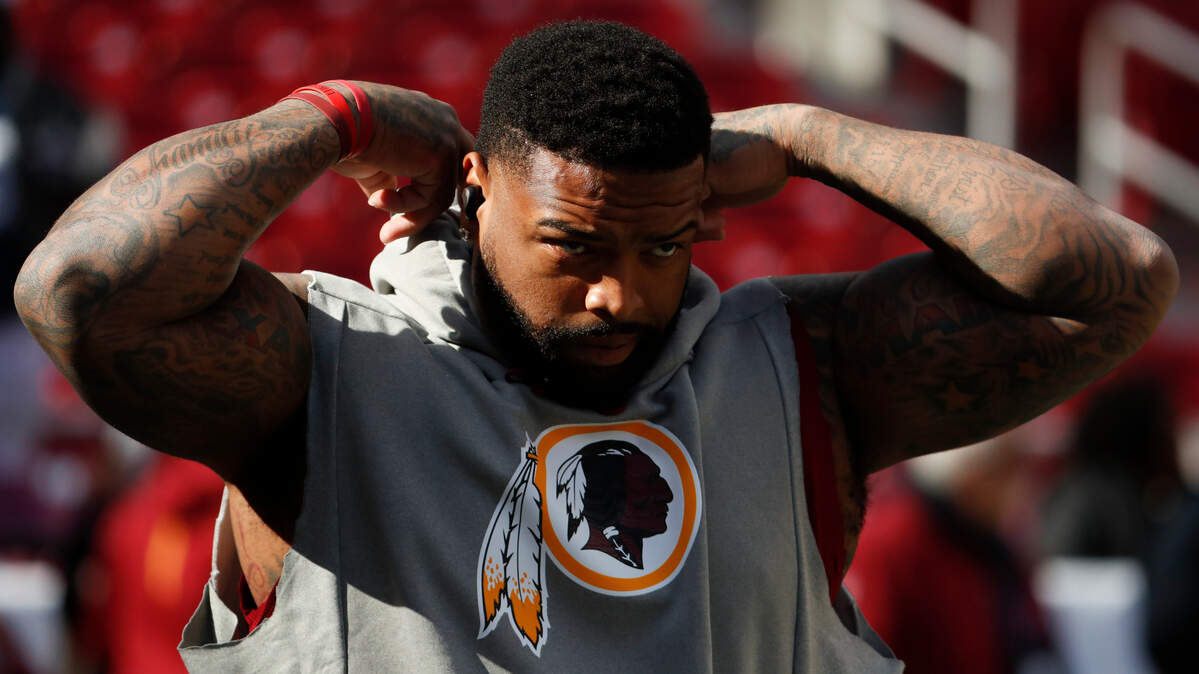 Washington Redskins offensive tackle Trent Williams (71) takes the field for warms up before an NFL football game against the Dallas Cowboys Sunday, Oct. 21, 2018, in Landover, Md. (AP Photo/Andrew Harnik)