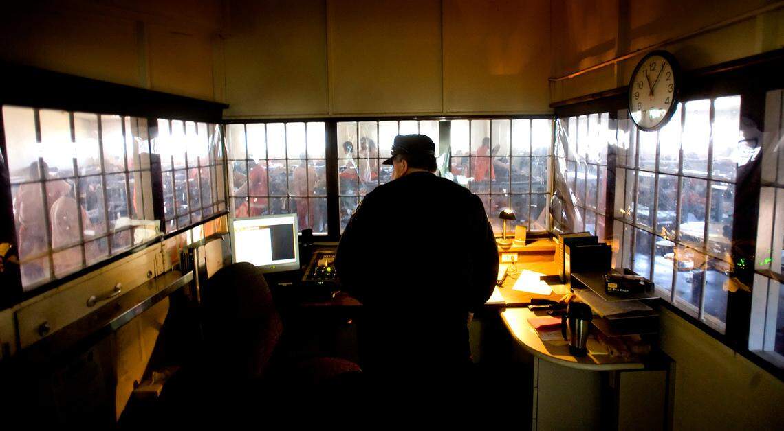 Officer Lawrence Ortiz stands watch in the control room at the Rio Cosumnes Correctional Center in Sacramento County on March 23, 2009.