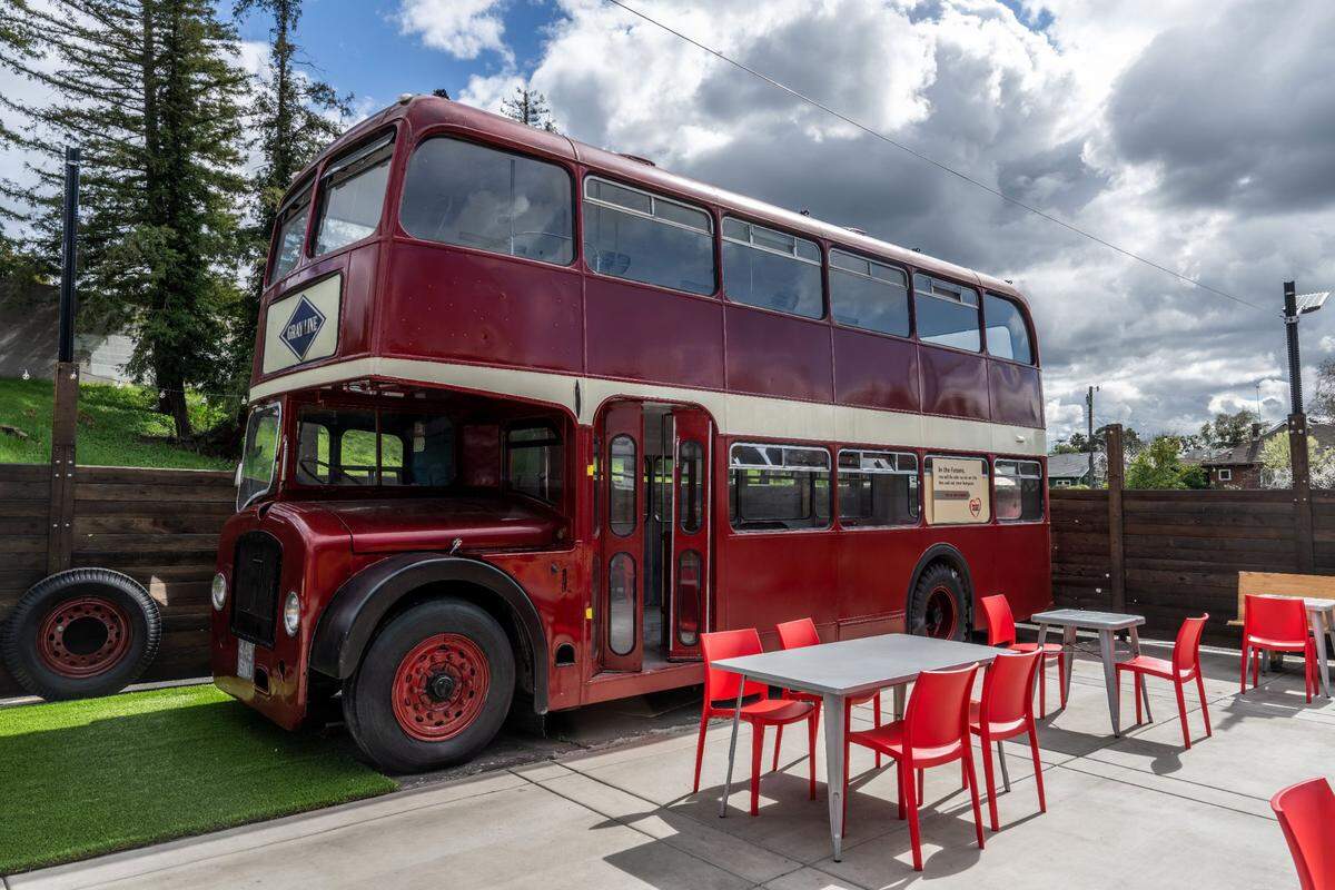 A double-decker bus is parked on the patio of Lucky’s Drive-In restaurant in Sacramento’s Curtis Park neighborhood on Thursday, March 6, 2025. The bus will have seating for customers later this year.