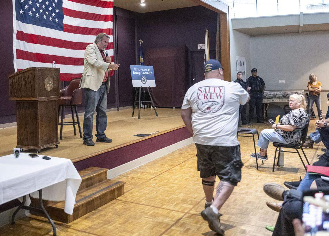 Rep. Doug LaMalfa, R-Oroville, stretches his hand towards veteran Ryan Rogowski, 48, of Chico, who asked a question about the lack of services for mental health during a town hall meeting on Monday in Chico.